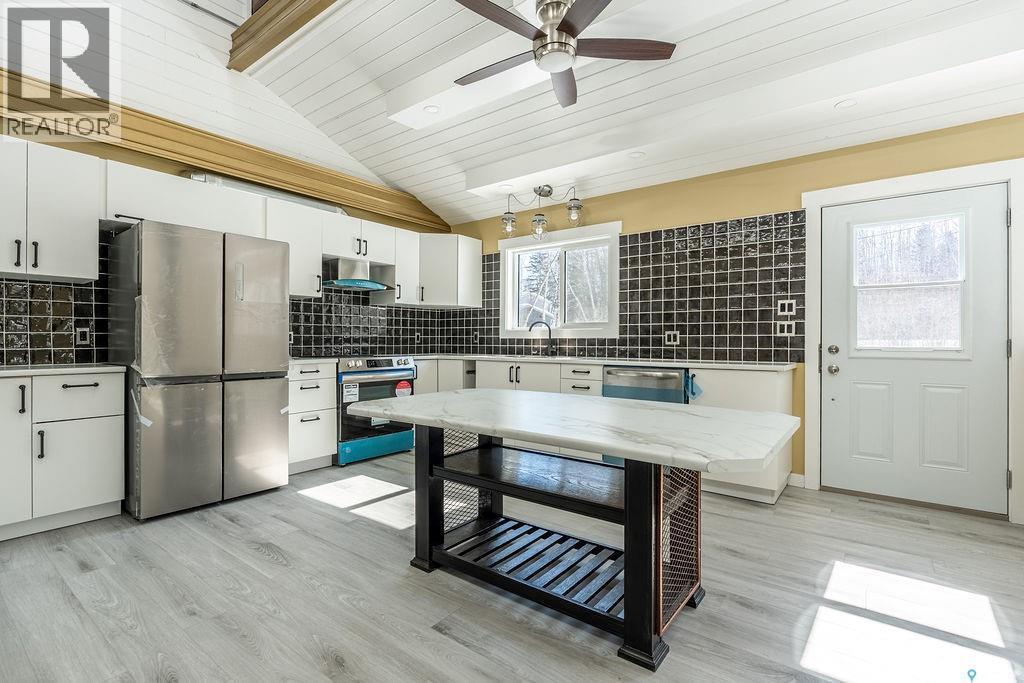 1 May Bay, Delaronde Lake, SK - Indoor Photo Showing Kitchen With Stainless Steel Kitchen With Upgraded Kitchen