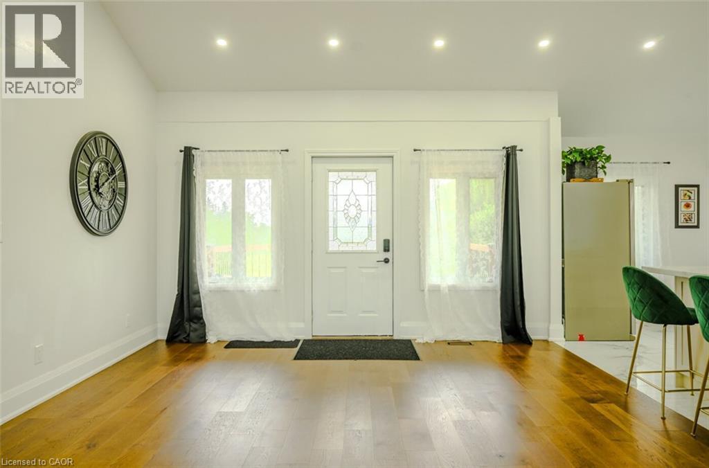 Wood-finish flooring throughout - 107 6Th Line Line, Caledonia, ON - Indoor Photo Showing Other Room