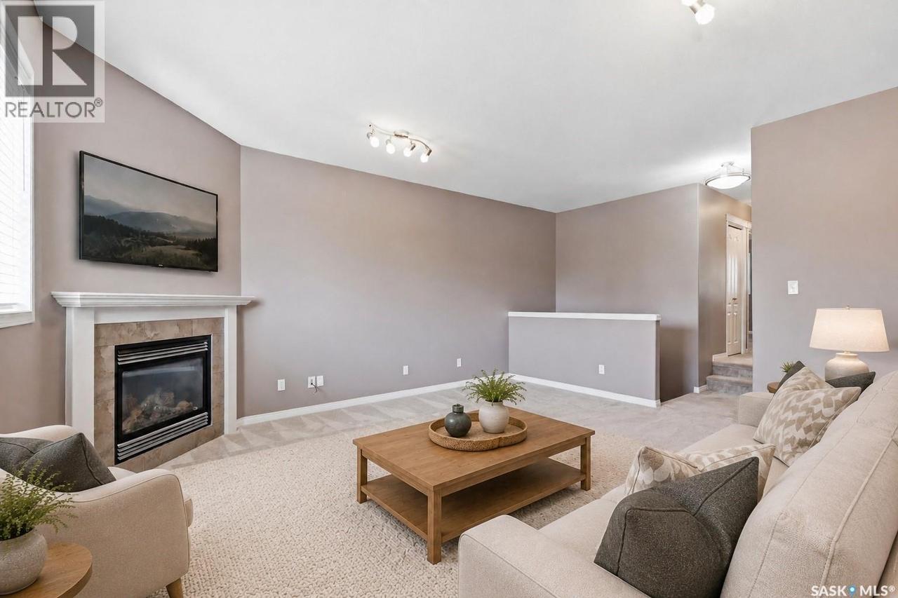 7 110 Dulmage Crescent, Saskatoon, SK - Indoor Photo Showing Living Room With Fireplace