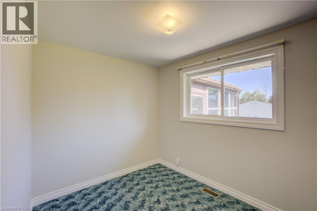 White-framed window and neutral wall tones - 52 Queenston Crescent, Kitchener, ON - Indoor Photo Showing Other Room