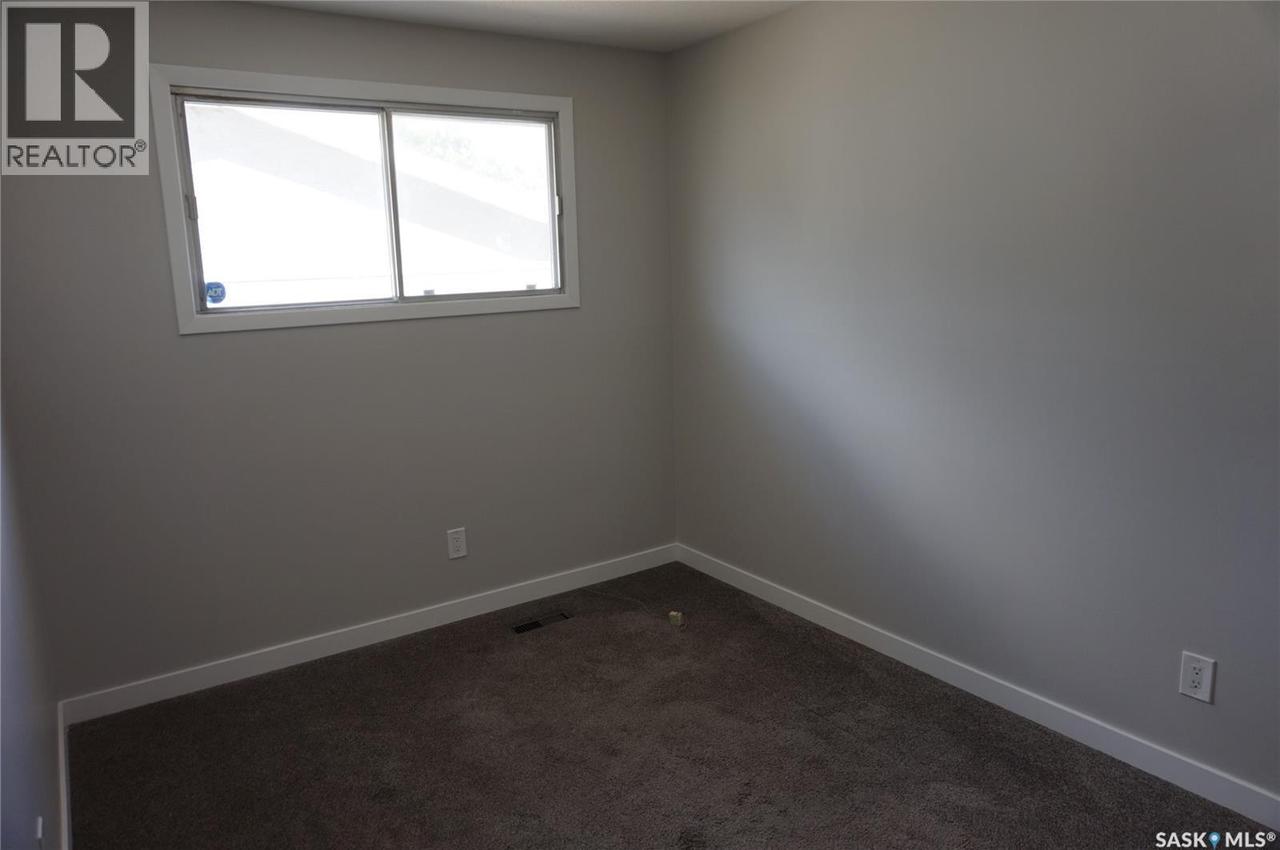 91 Plant Crescent, Regina, SK - Indoor Photo Showing Other Room