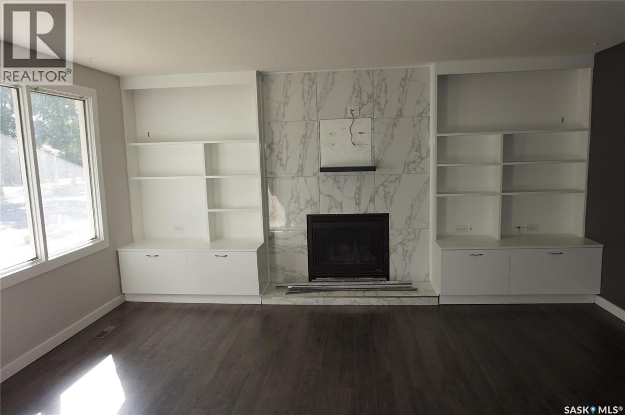 91 Plant Crescent, Regina, SK - Indoor With Fireplace