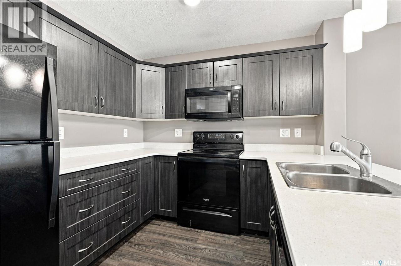 617 110 Akhtar Bend, Saskatoon, SK - Indoor Photo Showing Kitchen With Double Sink
