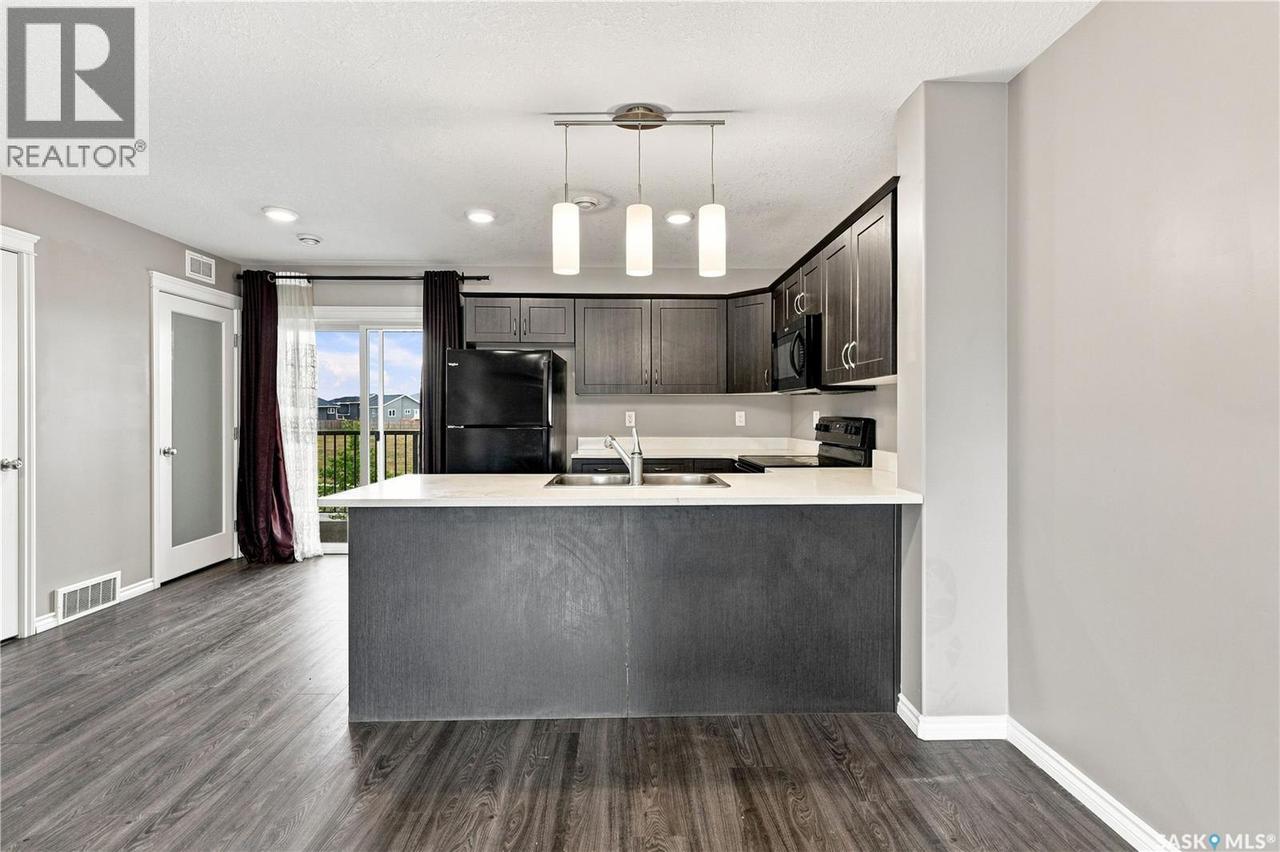 617 110 Akhtar Bend, Saskatoon, SK - Indoor Photo Showing Kitchen With Double Sink