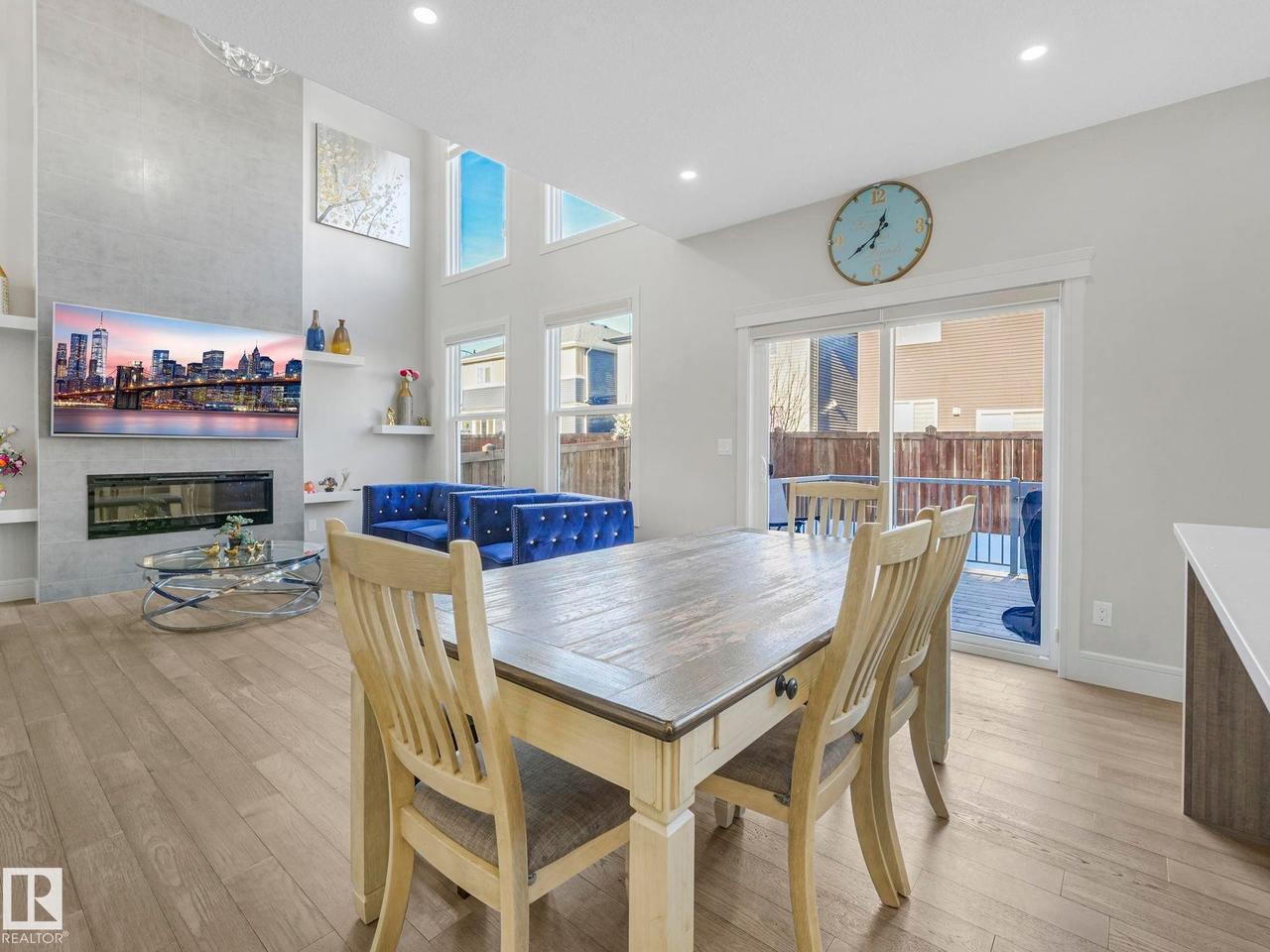 8641 Mayday Wynd Sw, Edmonton, AB - Indoor Photo Showing Dining Room With Fireplace