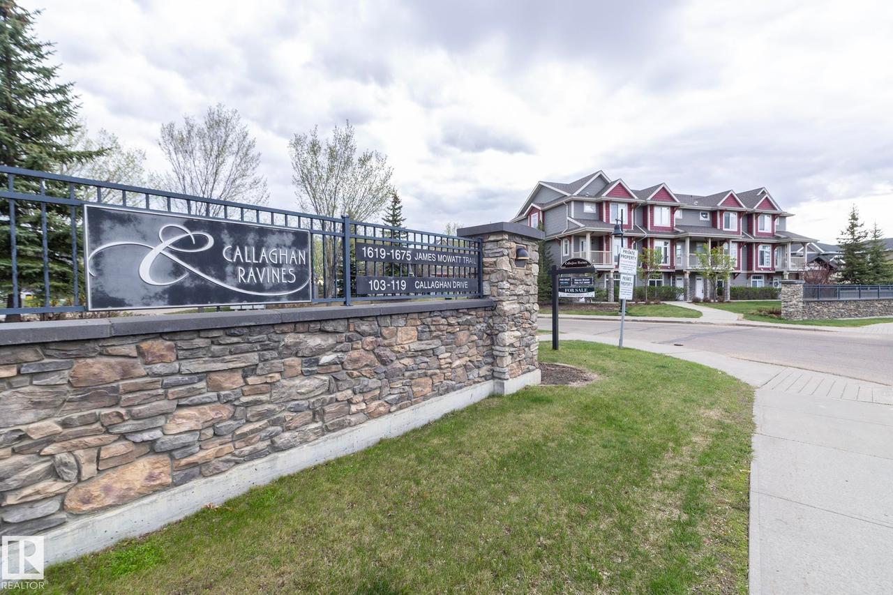 Stone veneer and wrought iron fencing define the property entrance - 117 Callaghan Drive Sw, Edmonton, AB - Outdoor