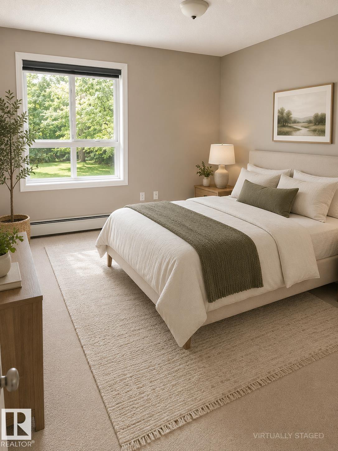 Carpeted room with a large window and neutral wall tones - #115 5340 199 St Nw, Edmonton, AB - Indoor Photo Showing Bedroom