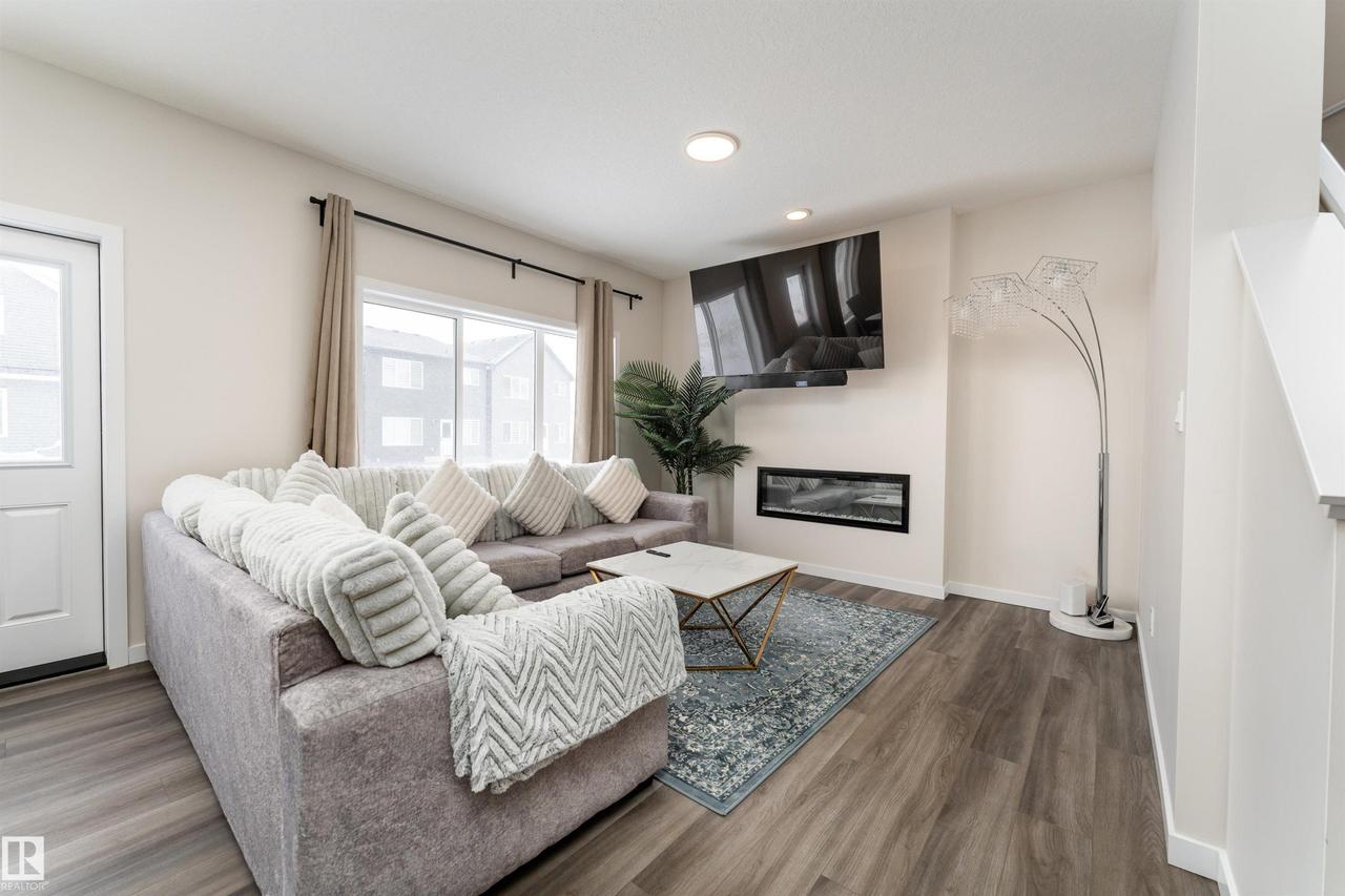 2120 Muckleplum Crescent Sw, Edmonton, AB - Indoor Photo Showing Living Room With Fireplace