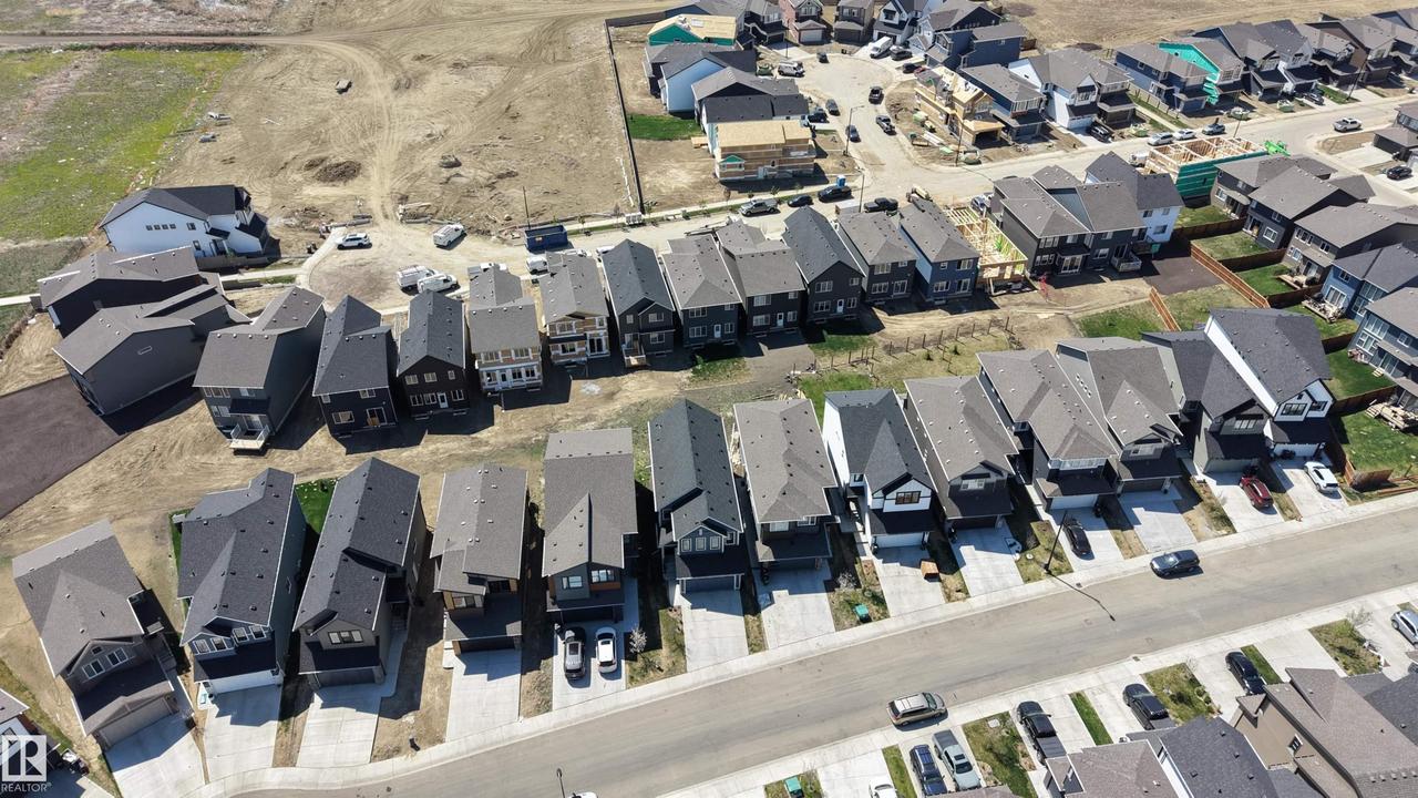 Aerial perspective showcasing a residential development with numerous single-family homes - 2120 Muckleplum Crescent Sw, Edmonton, AB -  Photo Showing Other Room