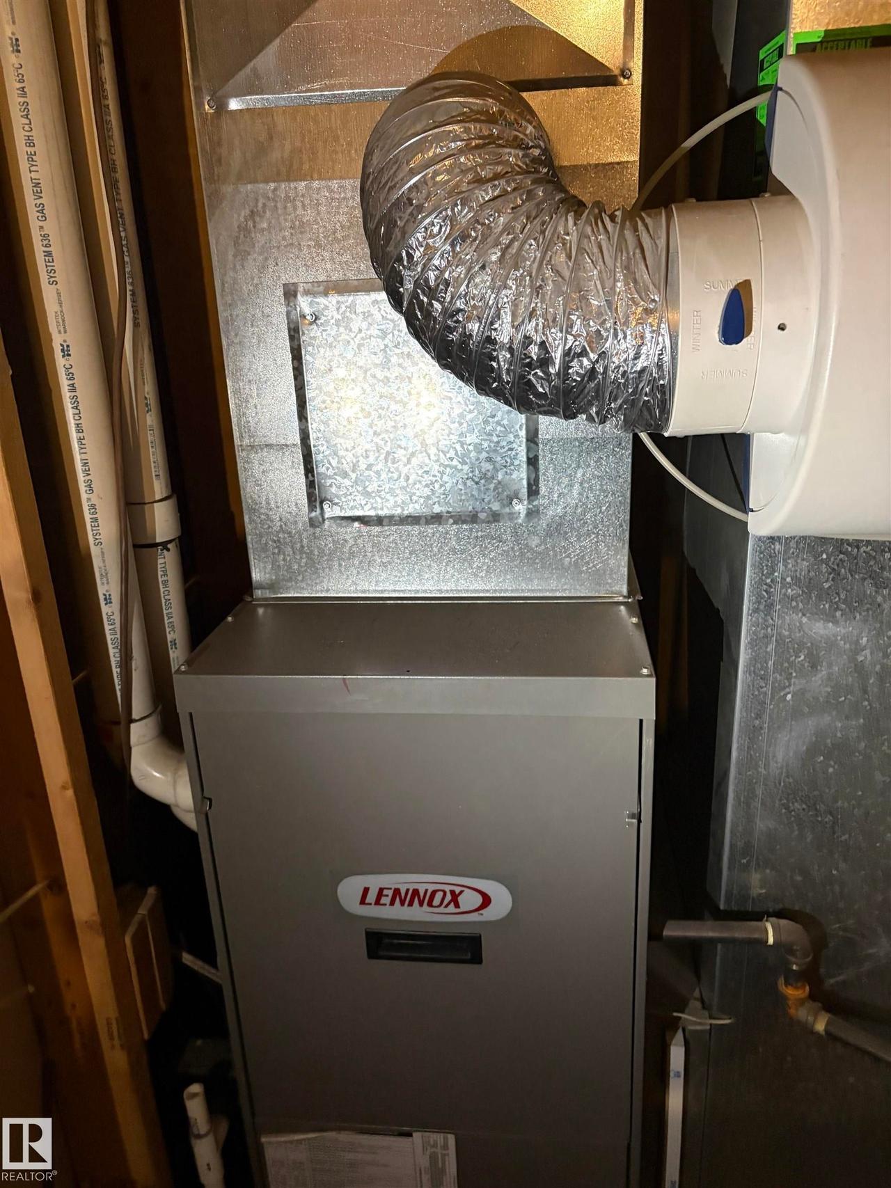 Lennox furnace with integrated humidifier and galvanized ductwork - #184 1804 70 St Sw, Edmonton, AB - Indoor Photo Showing Basement