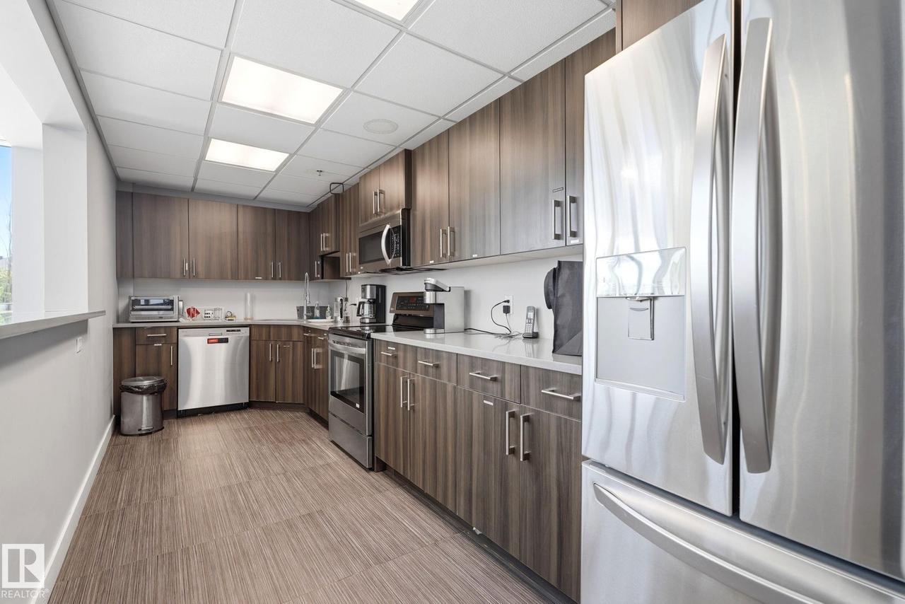 #125 5151 Windermere Boulevard Sw, Edmonton, AB - Indoor Photo Showing Kitchen With Stainless Steel Kitchen
