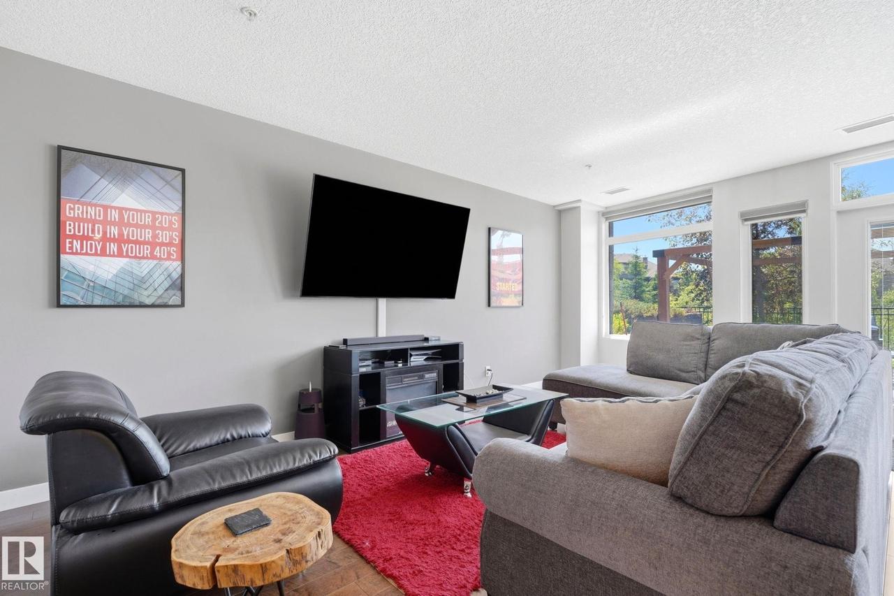 #125 5151 Windermere Boulevard Sw, Edmonton, AB - Indoor Photo Showing Living Room