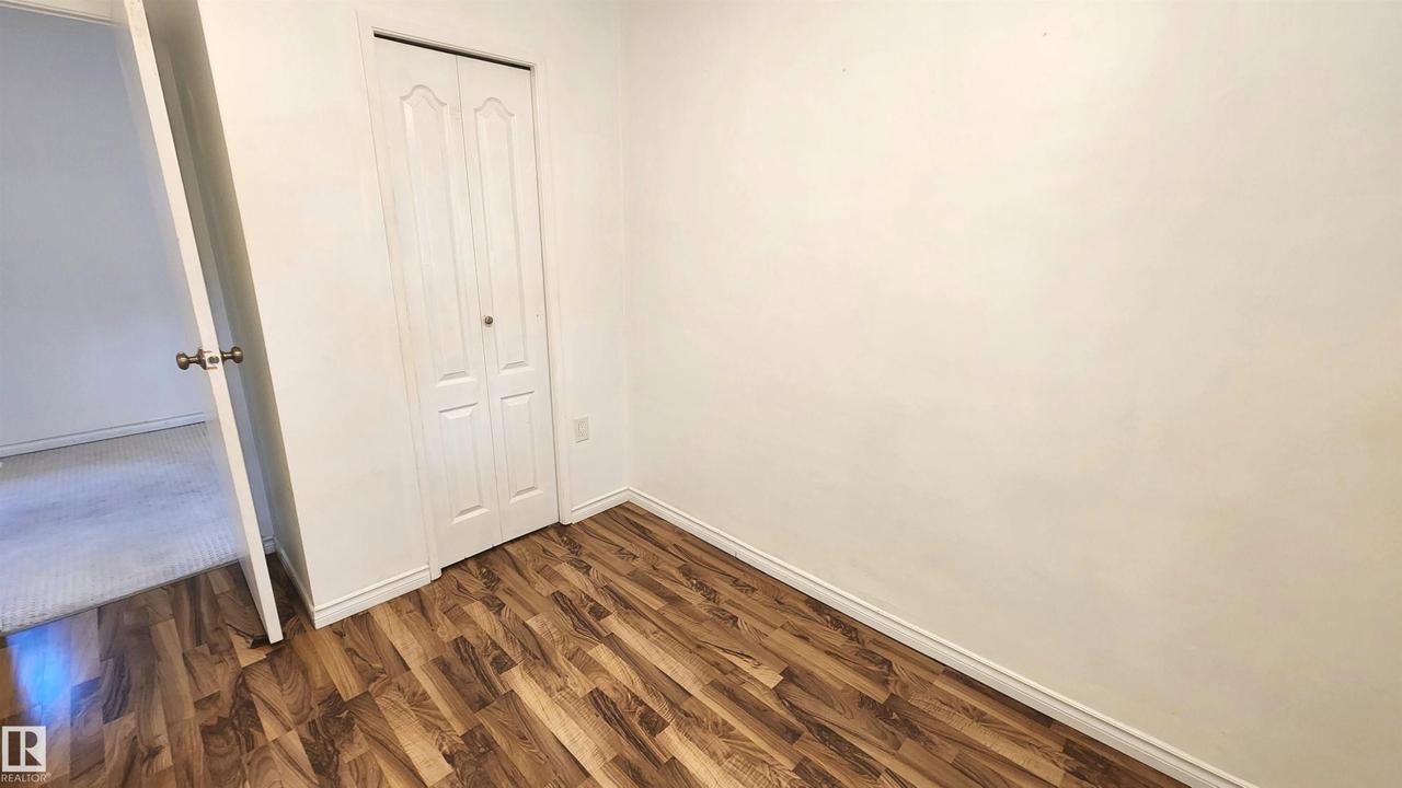 Neutral wall color throughout, offering a versatile backdrop - 9359 92 Street Nw, Edmonton, AB - Indoor Photo Showing Other Room