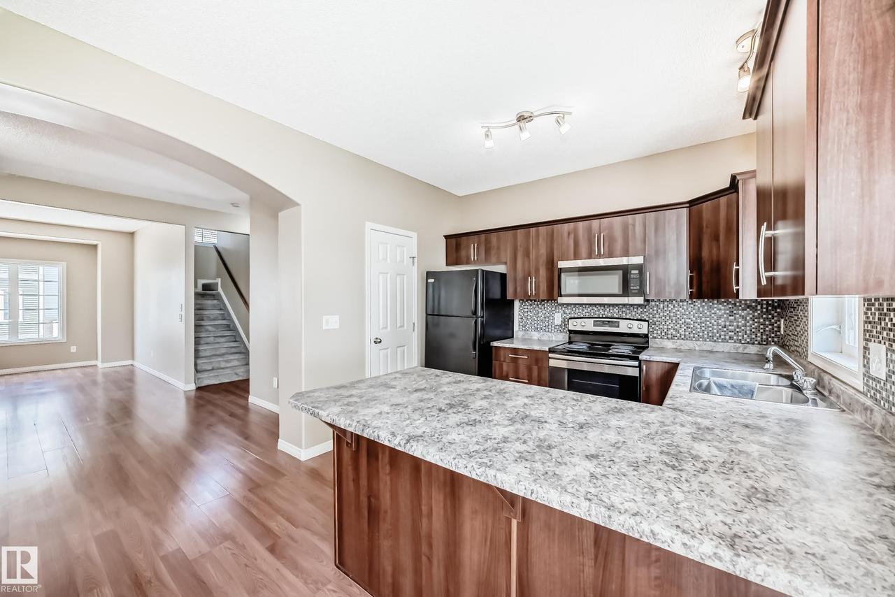 #4 5102 30 Av, Beaumont, AB - Indoor Photo Showing Kitchen With Double Sink With Upgraded Kitchen
