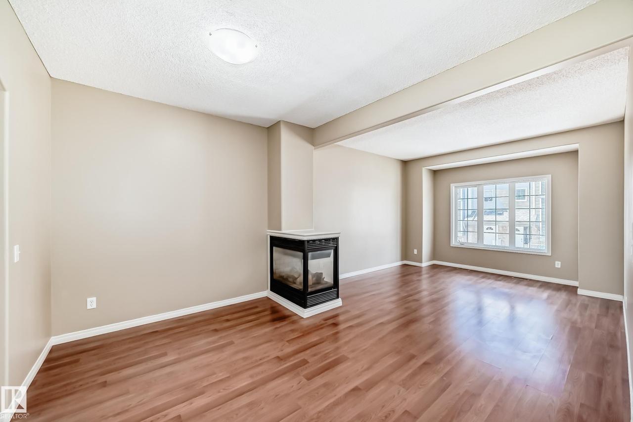 #4 5102 30 Av, Beaumont, AB - Indoor With Fireplace