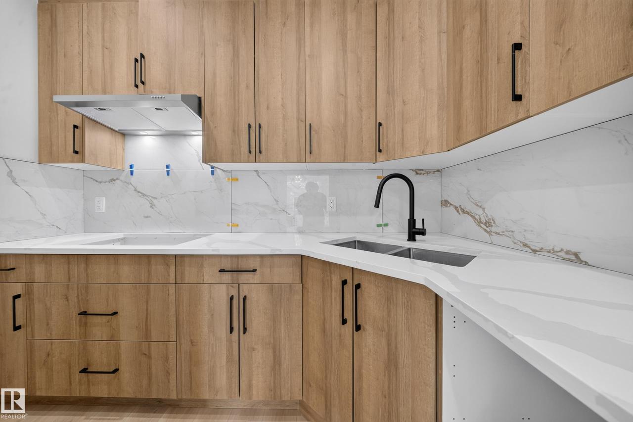 8512 Mayday Run Sw, Edmonton, AB - Indoor Photo Showing Kitchen With Double Sink