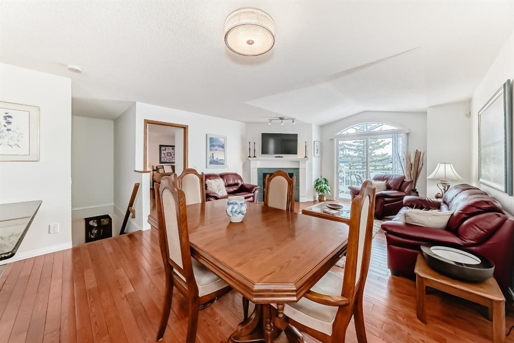 157 Hawkstone Manor Nw, Calgary, AB - Indoor Photo Showing Living Room With Fireplace