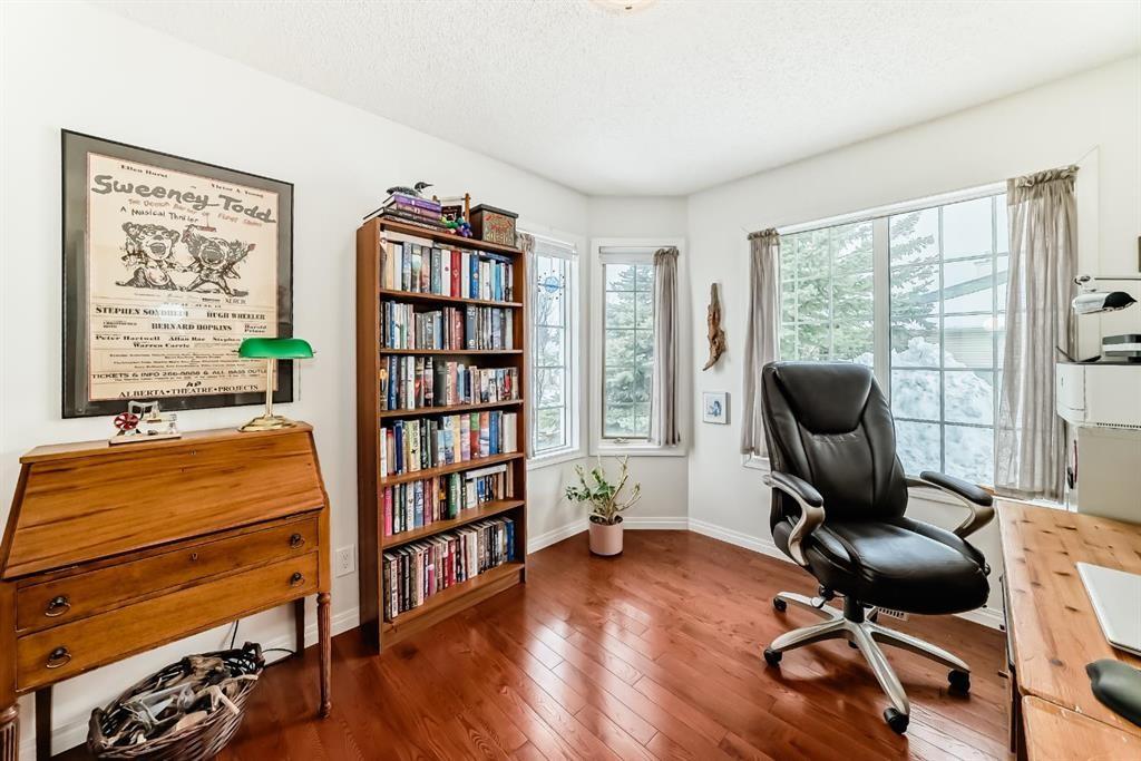 157 Hawkstone Manor Nw, Calgary, AB - Indoor Photo Showing Living Room With Fireplace