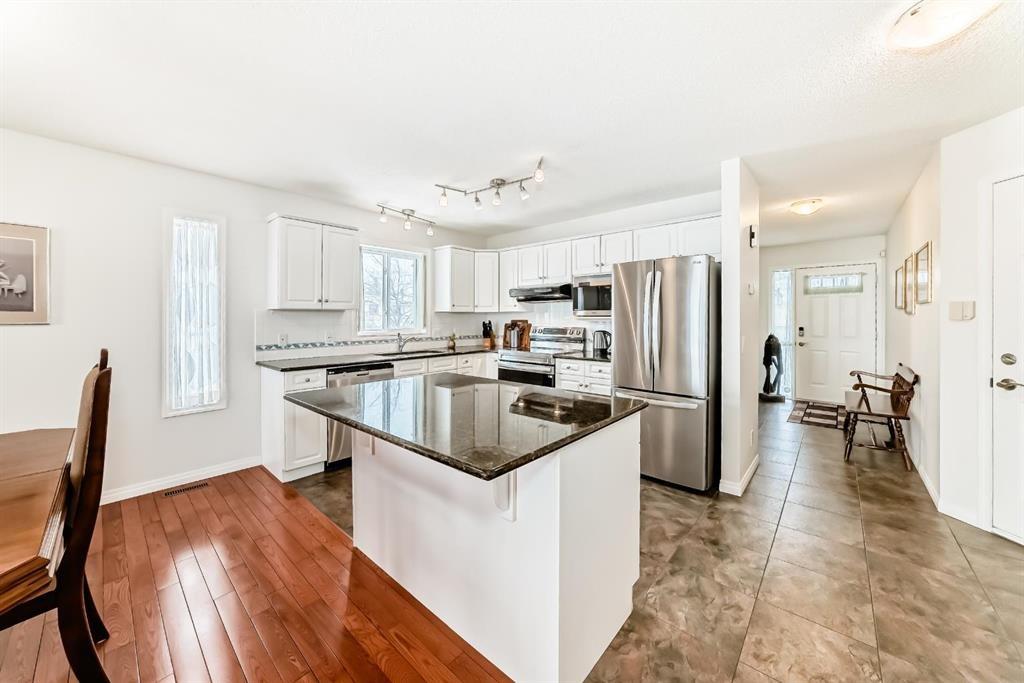 157 Hawkstone Manor Nw, Calgary, AB - Indoor Photo Showing Kitchen With Fireplace
