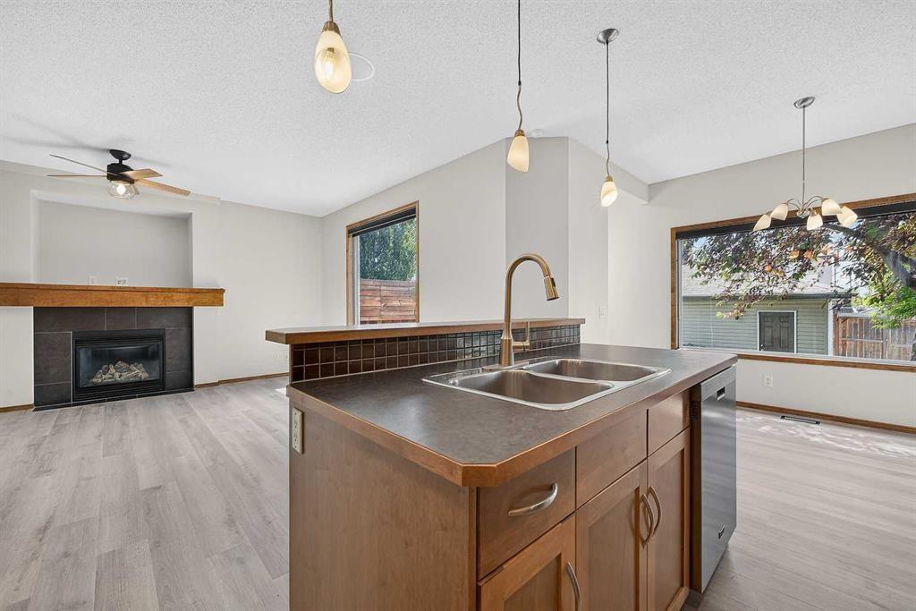 249 Elgin Manor Se, Calgary, AB - Indoor Photo Showing Other Room With Fireplace