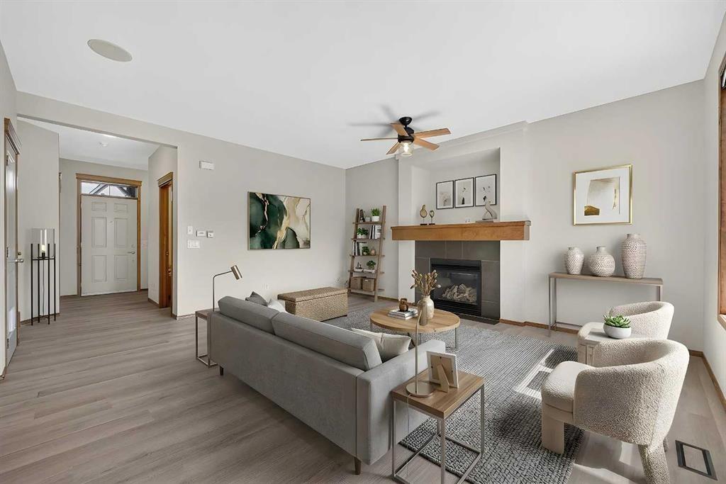 249 Elgin Manor Se, Calgary, AB - Indoor Photo Showing Living Room With Fireplace