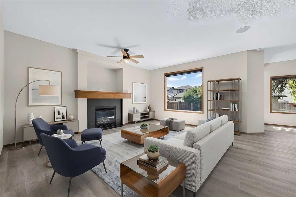 249 Elgin Manor Se, Calgary, AB - Indoor Photo Showing Living Room With Fireplace