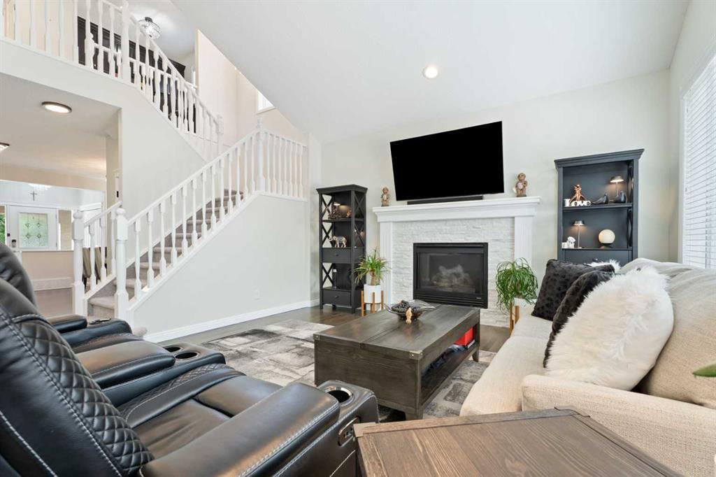 161 Cranleigh Bay Se, Calgary, AB - Indoor Photo Showing Living Room With Fireplace