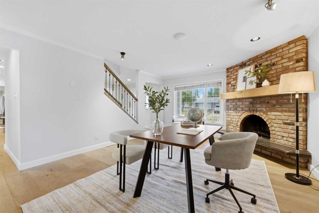 20 Mapleglade Close Se, Calgary, AB - Indoor Photo Showing Dining Room With Fireplace