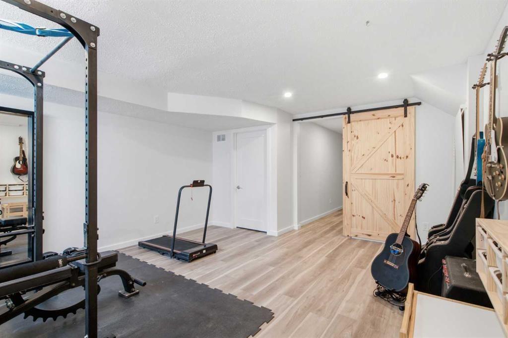 406 Masters Road Se, Calgary, AB - Indoor Photo Showing Gym Room