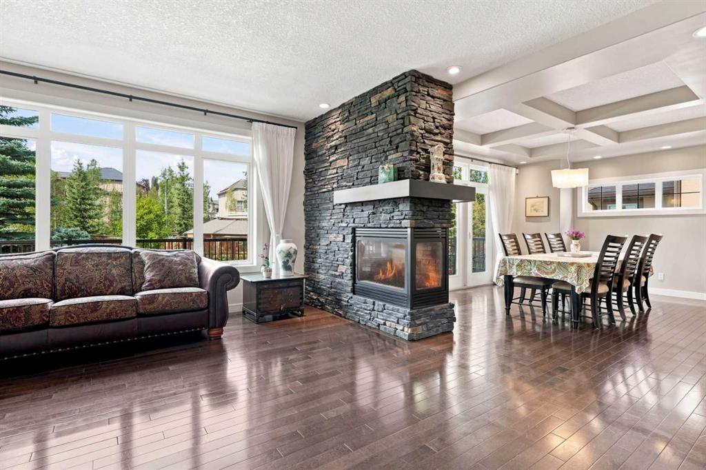 163 Cranarch Circle Se, Calgary, AB - Indoor Photo Showing Living Room With Fireplace