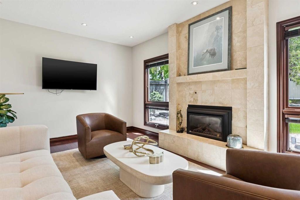 223 Pump Hill Crescent, Calgary, AB - Indoor Photo Showing Living Room With Fireplace