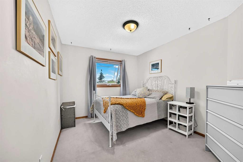 228 Arbour Ridge Way Nw, Calgary, AB - Indoor Photo Showing Bedroom