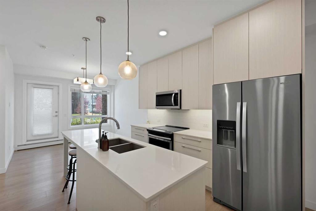 2101-76 Cornerstone Passage Ne, Calgary, AB - Indoor Photo Showing Kitchen With Stainless Steel Kitchen With Double Sink With Upgraded Kitchen