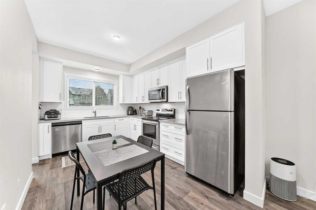 112 Carrington Boulevard Nw, Calgary, AB - Indoor Photo Showing Kitchen With Stainless Steel Kitchen