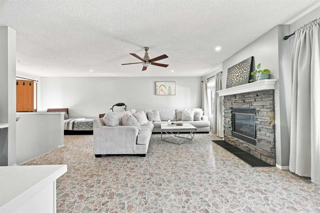 15230 Prestwick Boulevard Se, Calgary, AB - Indoor Photo Showing Living Room With Fireplace